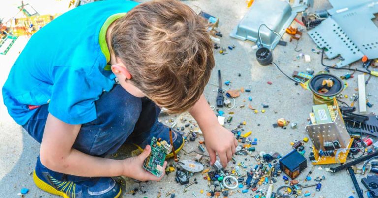 Child building with spare parts